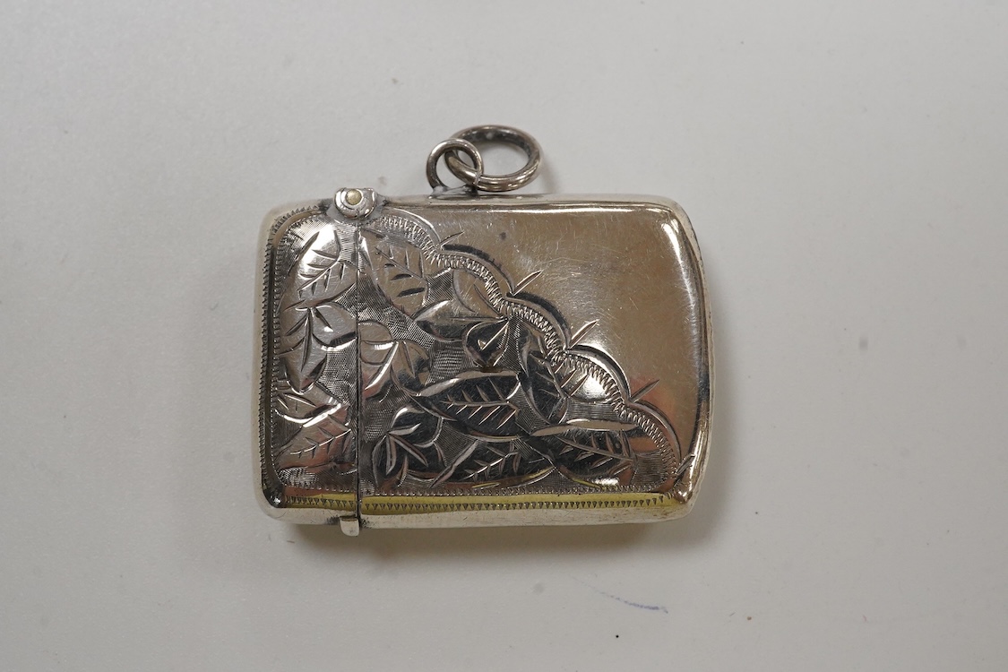 A George V silver mounted fan pin cushion, Henry Matthews, Birmingham, 1912, width 62mm, together with an Edwardian silver vesta case and a white metal pig vesta case.